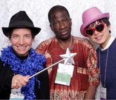 Professors, Anabel, Isola and Shengnan pose together at photobooth  