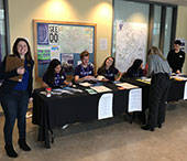FIMS staff and student ambassadors at the registration table.