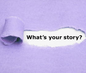 A purple piece of paper torn to reveal the words what's your story?