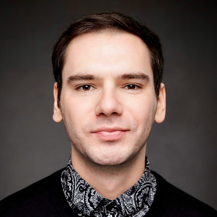 Headshot of Eduard Sviridenko in a black sweater