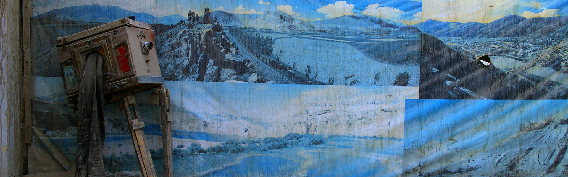 Antique cameral leaning against a painted backdrop