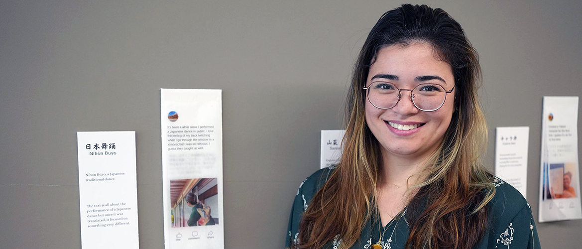 Shayla Reyes stands in front of her project