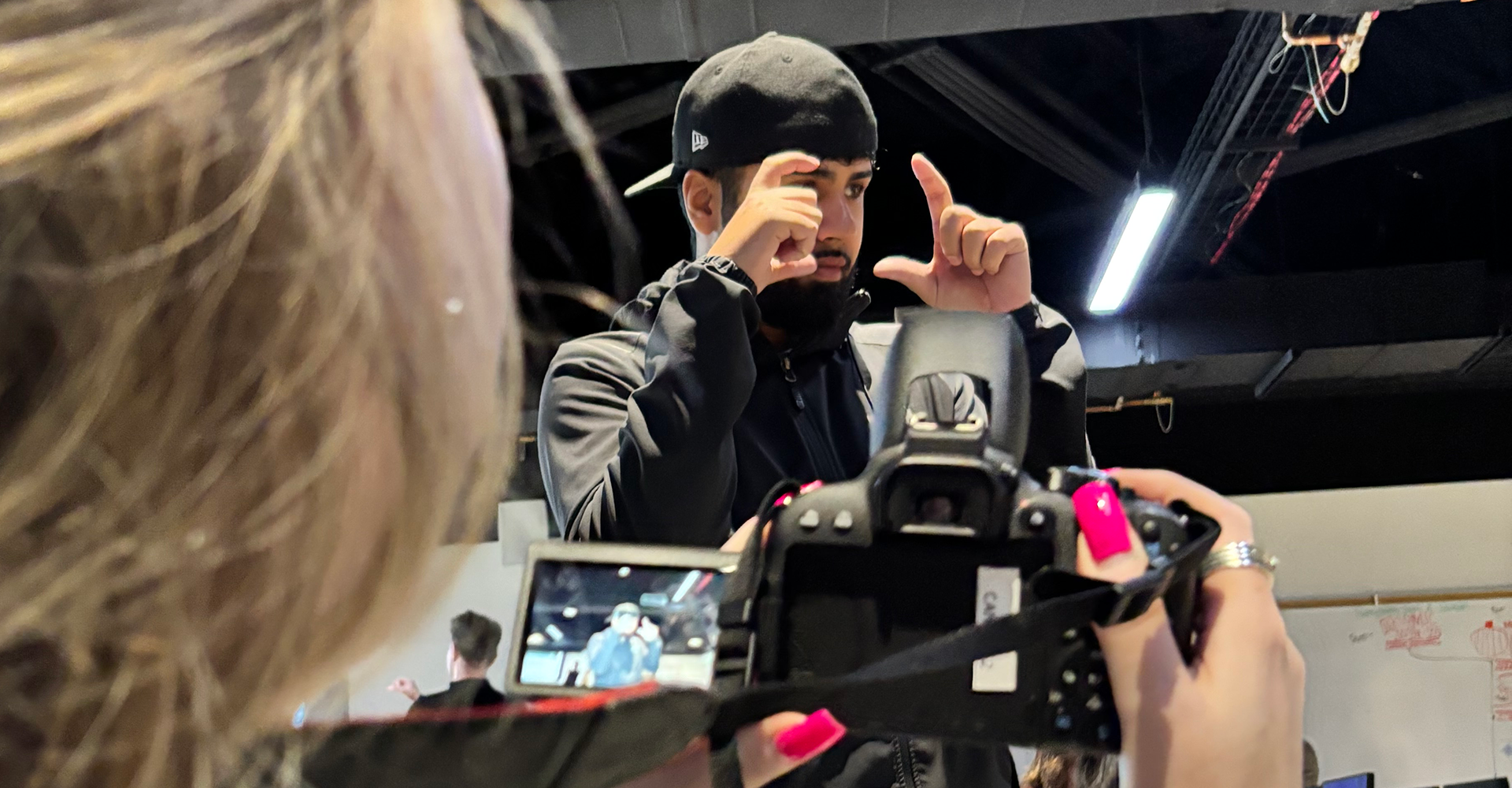 Two students working with a camera