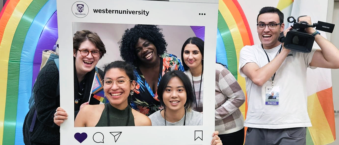 Students on assignment having fun with an Instagram display