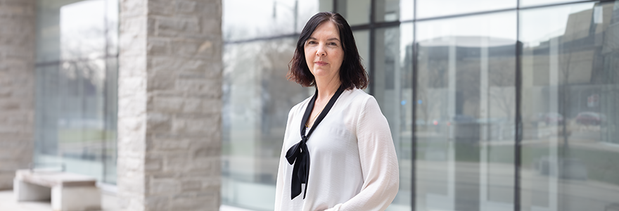 Professor Joanna Redden stands outside the FIMS & Nursing Building
