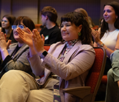 Audience clapping for a speaker at Careerchella.