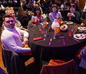 A table of alumni guests having dinner at the Wave during Careerchella.