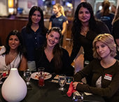 A table of MACS students enjoy dinner at the Wave during Careerchella.