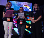 FIMS staff members Claire Jordan, Heather Maccrone and Kathie Hess give prizes away at the Wave during Careerchella.