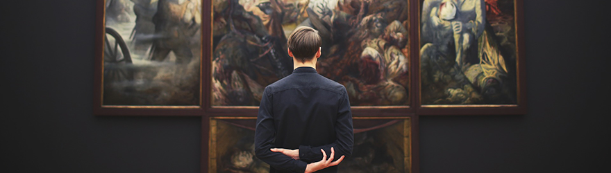 Man looking at art in a museum