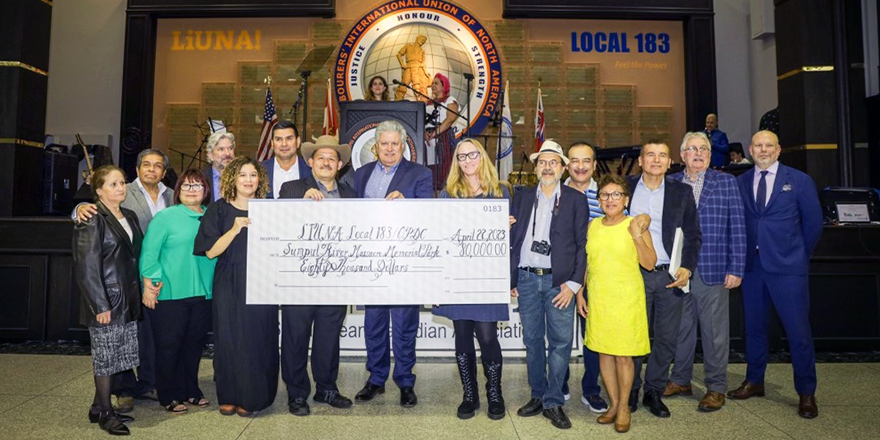 Group photo of the cheque being presented