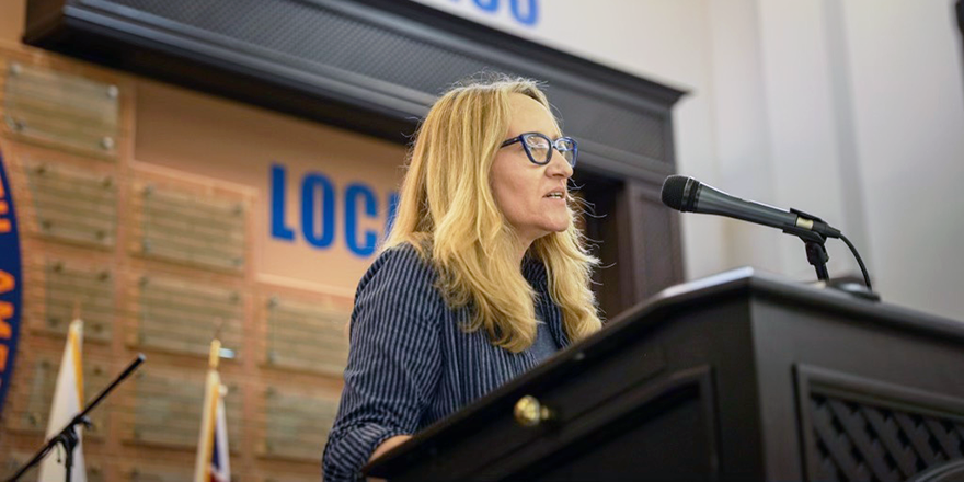 Amanda Grzyb speaking from a podium