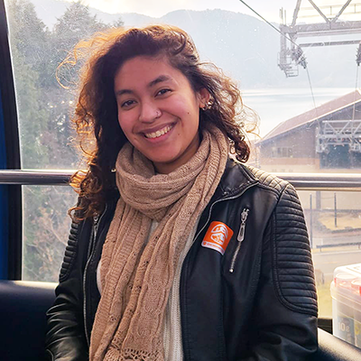 Photo of Janessa Ventura-Alvarenga wearing a black, leather jacket and scarf