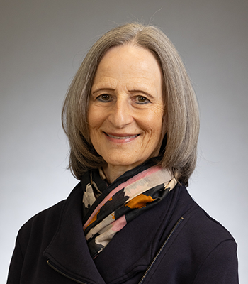 Photo of Mary Ann Mavrinac in a black top and decorative scarf