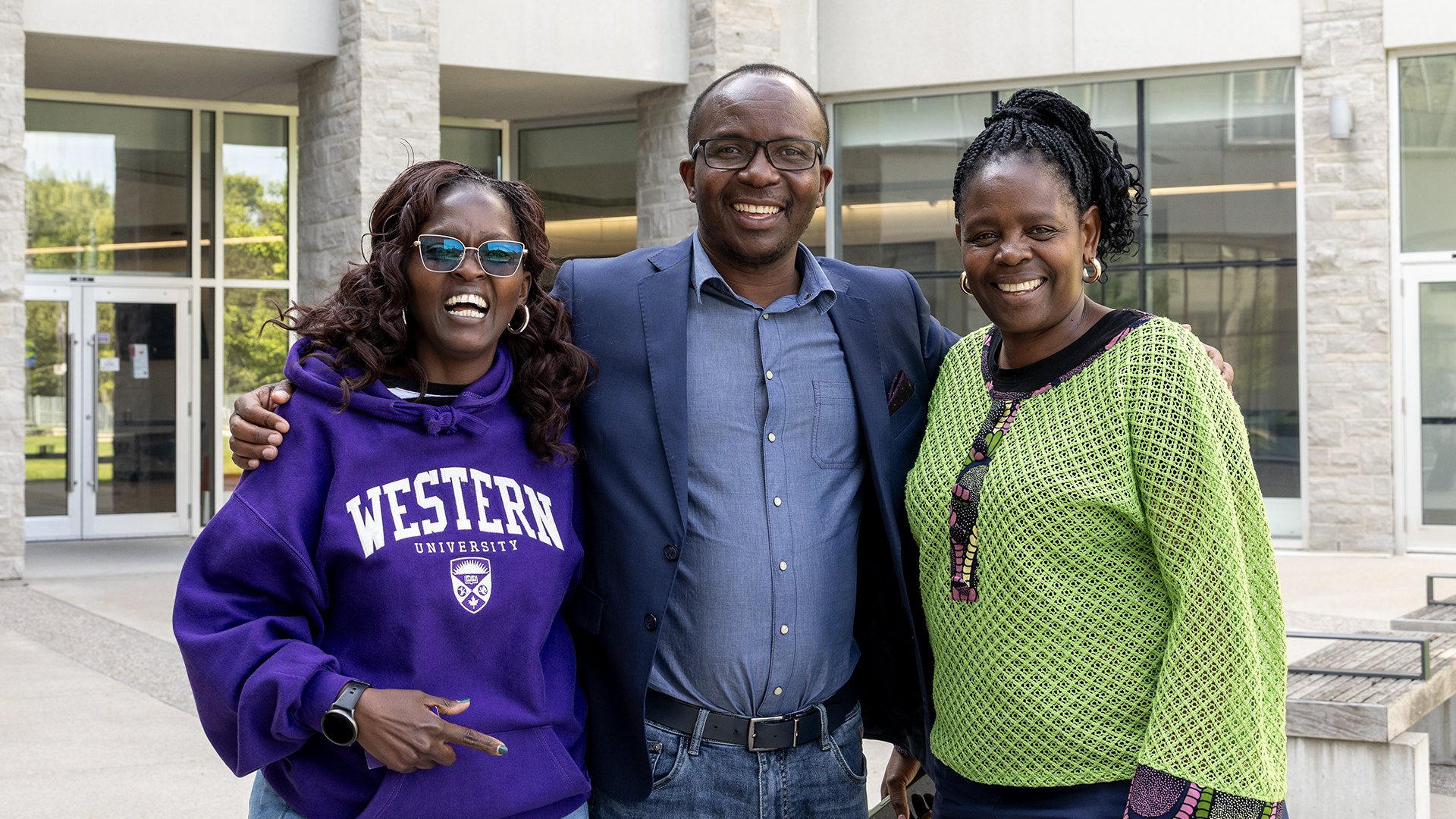 three of returning participants of FIMS Summer School posing together