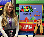 Meghan Houlihan (BA'03) poses in front of her Career Conference promotional poster.