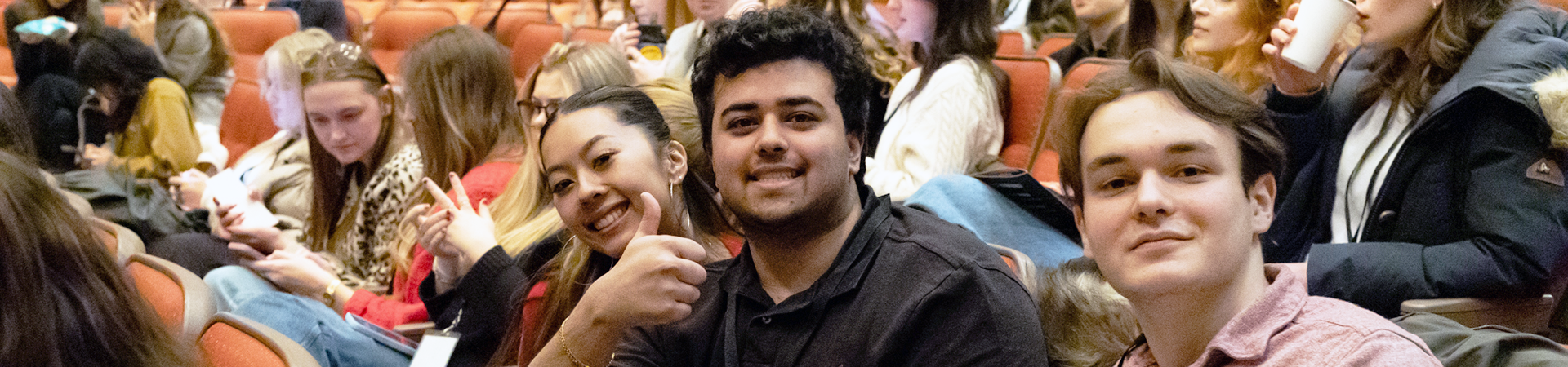 FIMS students sitting in an auditorium